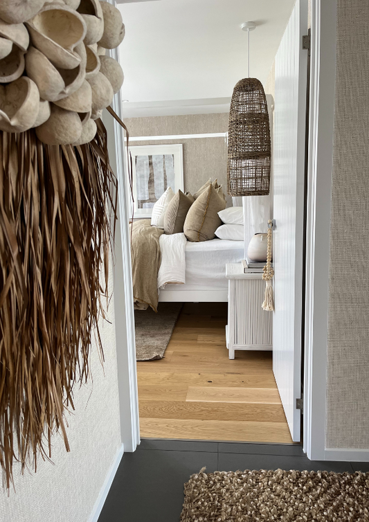 Decorative wall art with natural elements in a room with wooden flooring and furniture. Bungalow Interiors Design Studio & Showroom, Runaway Bay, Gold Coast