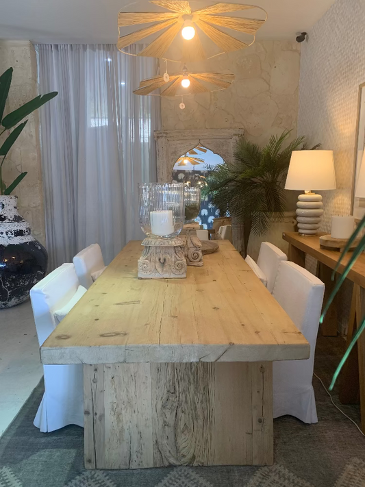 Dining room with a wooden table and chairs, decorative elements, and plants. Bungalow Interior Design, Gold Coast