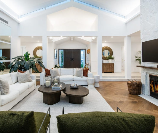 Modern living room with white sofa, coffee table, and decorative elements. Home styling Bungalow Interiors Gold Coast