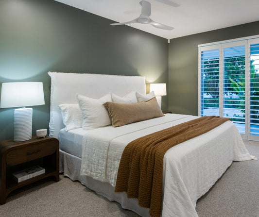 Bedroom with a bed, nightstands, and lamps in a home setting. Home styling Bungalow Interiors Gold Coast