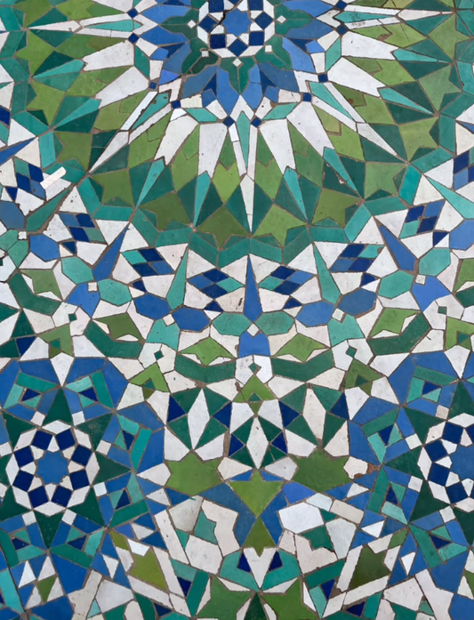 Mosaic pattern with geometric shapes in blue, green, and white