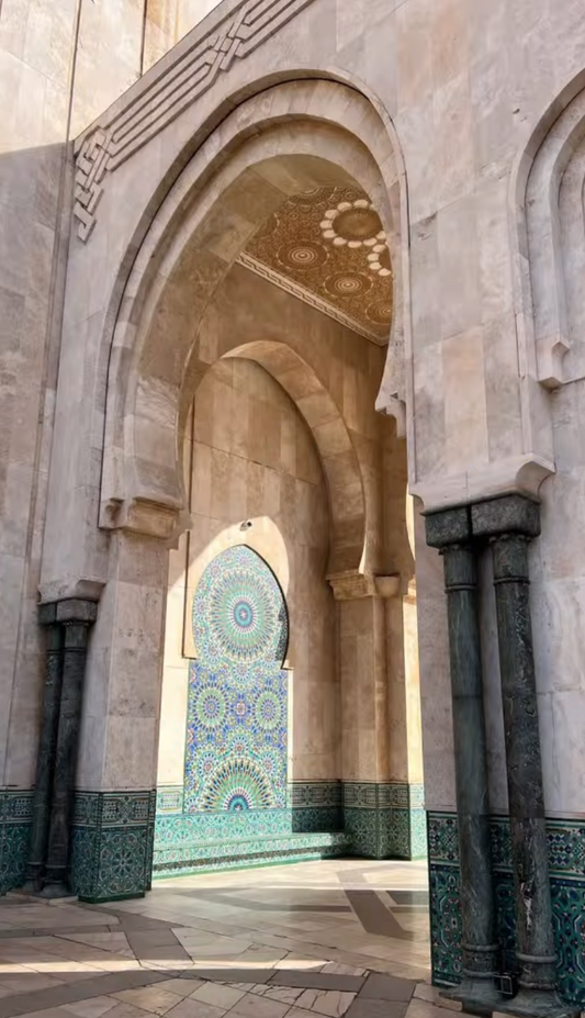 Arched entrance with decorative tiles and intricate patterns