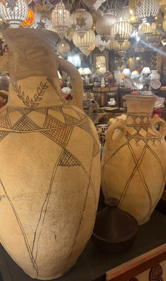 Decorative ceramic vases with geometric patterns in a store setting.