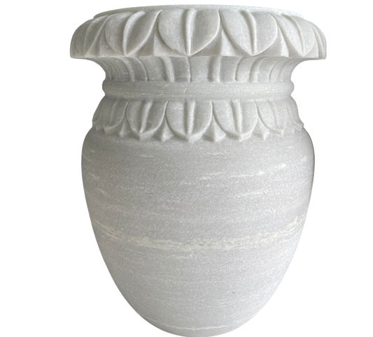 A white marble carved pot with a floral shape design.