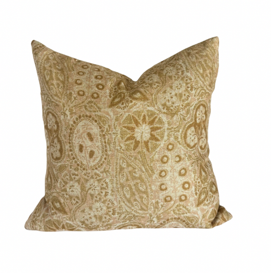 Decorative pillow with paisley pattern on a white background