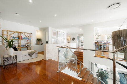 Modern interior with a staircase, living room, and kitchen. Bungalow Interiors home styling, Gold Coast